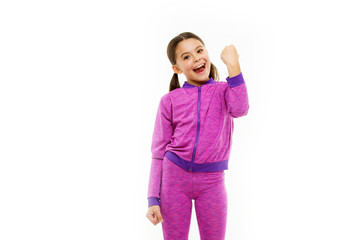 childrens day. Portrait of happy little child. Happy little girl with long hair. Kid fashion and sportswear. Small girl child. Sport and fitness. childhood happiness. Family. Feeling free and happy