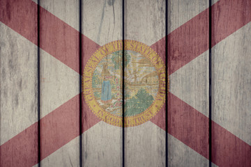 USA Politics News Concept: US State Florida Flag Wooden Fence