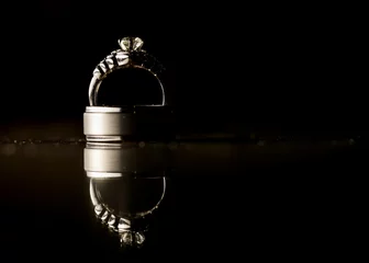 Fotobehang wedding rings, dark background, reflection, black and white, shiny, rings isolated, jewelry © JoelandAndrea
