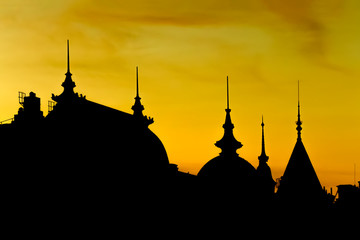 Fototapeta premium silhouette of old buildings in stockholm at sunset