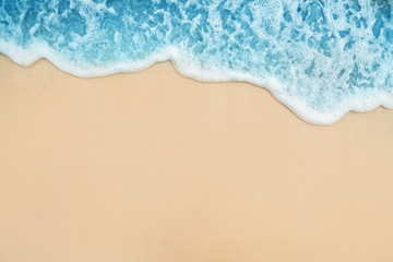 Fototapeta na wymiar Background of Soft Blue Ocean Wave On Sandy Tropical Beach.