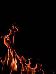 Flames of fire on a black background. Space for copy, text, your words. Vertical