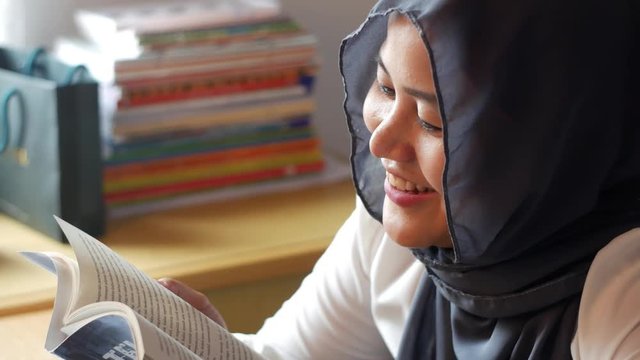 Muslim Woman Reading a Book