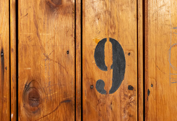 number 9 on door of storage room for tenants in century-old apartment building in stockholm