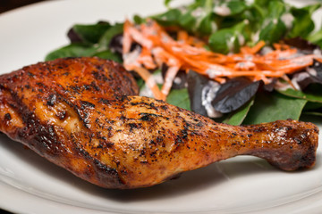 healthy lunch of grilled leg of chicken and salad