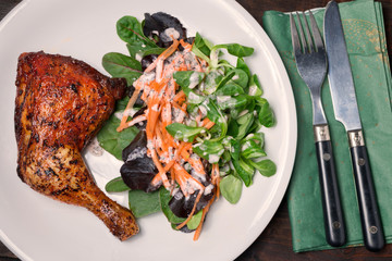healthy lunch of grilled leg of chicken and salad