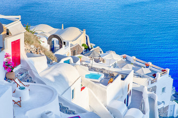 Obraz premium Famous Destinations. Breathtaking View of Classic White Roofed Houses and Pastel-Blue Colors of Oia Village on Santorini Island in Greece