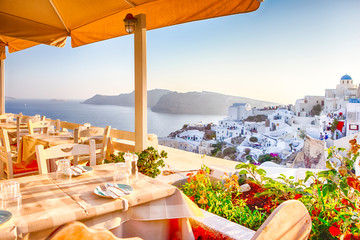 Open Air Cosy Restaurant in Beautiful Oia Village on Santorini Island in Greece Straight Before the Sunset.