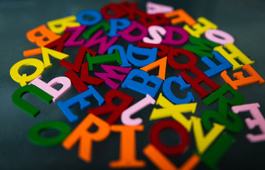 colored letters on a dark background. day of knowledge. school.