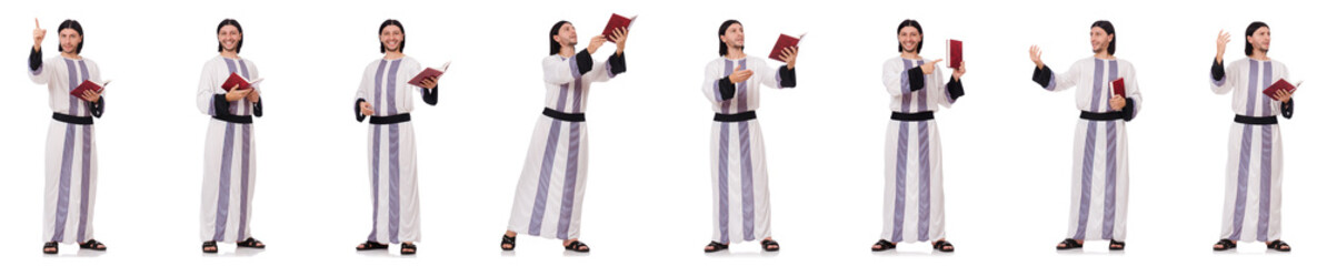 Arab man with koran isolated on white