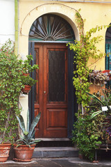 Fototapeta na wymiar Old wooden door, Lucca, Italy