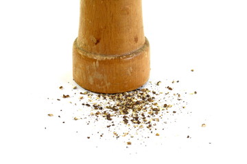 Pepper mill on a white isolated background with peppers