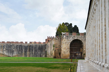 Medieval city wall and gate in Pisa, Italy