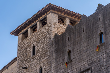 Fototapeta na wymiar View of medieval buildings, tower and street in Girona Catalonia, Spain with blue sky, popular tourist town one hour from Barcelona