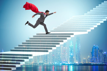 Superhero businessman climbing career ladder