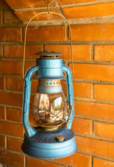 Lantern jumping off brick background
