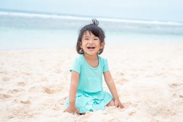 a daughter happy when holiday at the beach