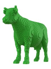 Green cow from plastic blocks on a white background.