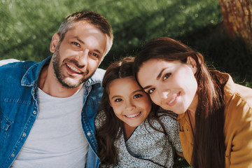 Smiling family is spending wonderful weekend outdoor