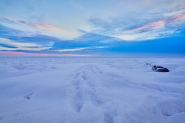 Fototapeta na wymiar Sunset over frozen Lake