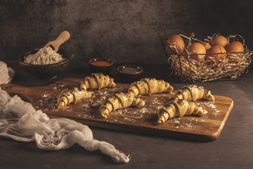 Raw croissant with ingredients