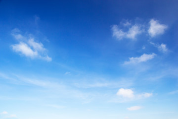 Blue sky background and white clouds soft focus, and copy space