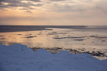 Time Lapse Video of the Winter Sunrise Snow Baltic Beach, Latvia, Saulkrasti. Frozen Sea With Ice Stacks