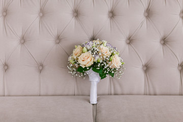 wedding bridal bouquet on the couch