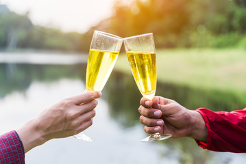 Couple traveller man and women celebrating in holiday with drinking  champagne