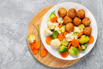Meatballs with broccoli and a cauliflower
