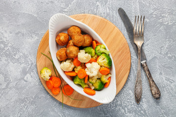 Meatballs with broccoli and a cauliflower