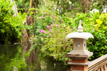 Balinese lantern on a background of green garden.