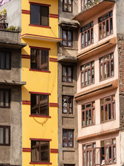 Yellow and brown old building facade at Kathmandu, Nepal.