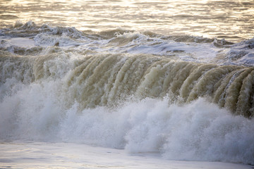 Dirty large crashing waves along the coast after a southerly has been through