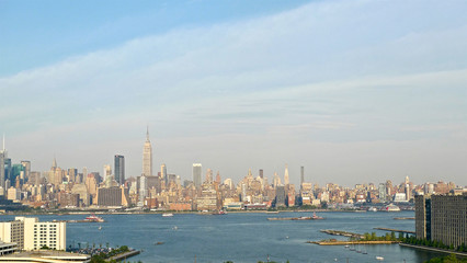 A view of the buildings and skyscrapers of New York City's midtown Manhattan as seen across the Hudson river from New Jersey.