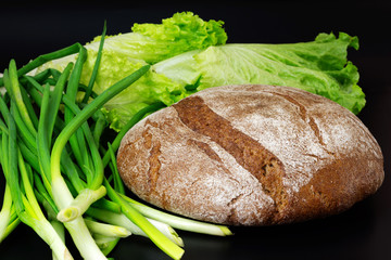 Bread and green vegetables salad and onions. Fresh and healthy food