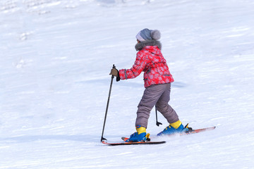 Children have fun and relax in the mountains in winter skiing.