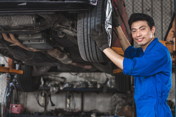 Mechanic checking the wheels of car And is about to change tires - Image