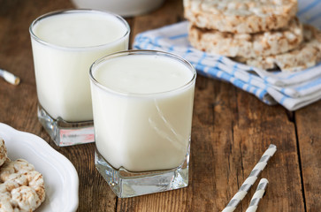 Two glasses of fresh yogurt on a wooden table     