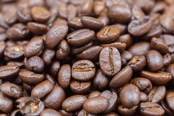 Brown roasted coffee beans texture background for food and drink or agriculture concept design.