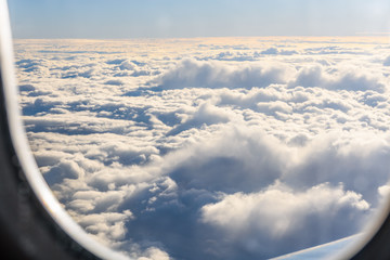 View on white clouds from the airplane window