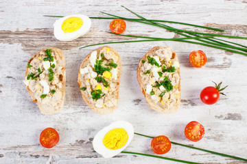 Baguette with mackerel fish paste and ingredients for preparing sandwiches