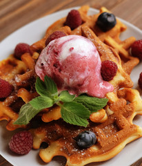 Belgian waffles with fresh berries and ice cream 