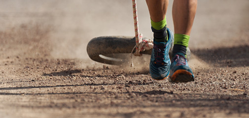 Athlete pulling car tires at a training run © pavel1964