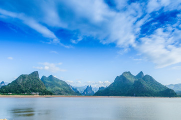 The mountains and river scenery with blue sky 