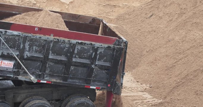 Truck dumping dirt 4k 60p