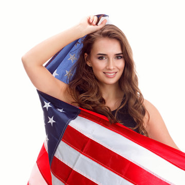 Happy young woman holding USA flag. Image isolated