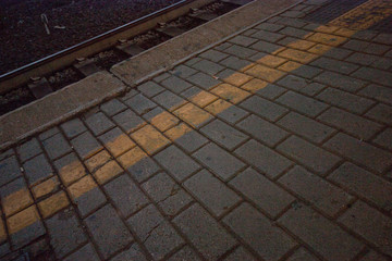 paving with yellow line at the station