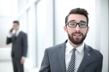 close up.businessman with glasses on the background of the office