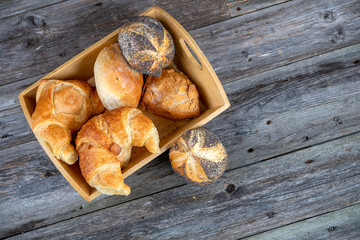 different fresh rolls and croissants in top view